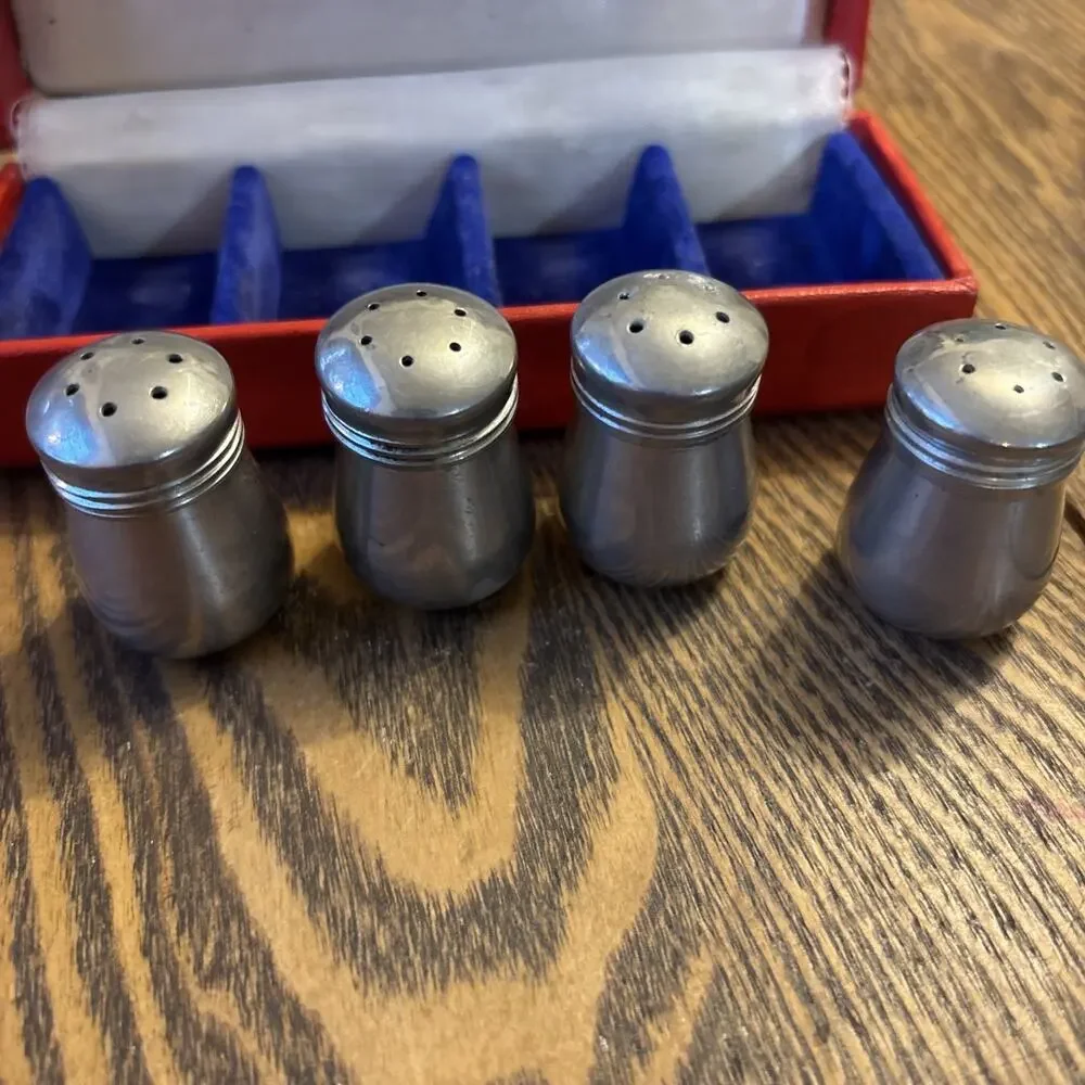 4 Salt and Pepper Shakers in Original Box pre owned silver colored